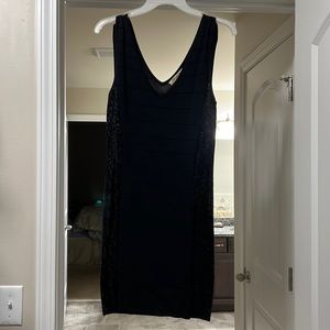 Black bandage v neck dress with sequins on the side. Size medium.